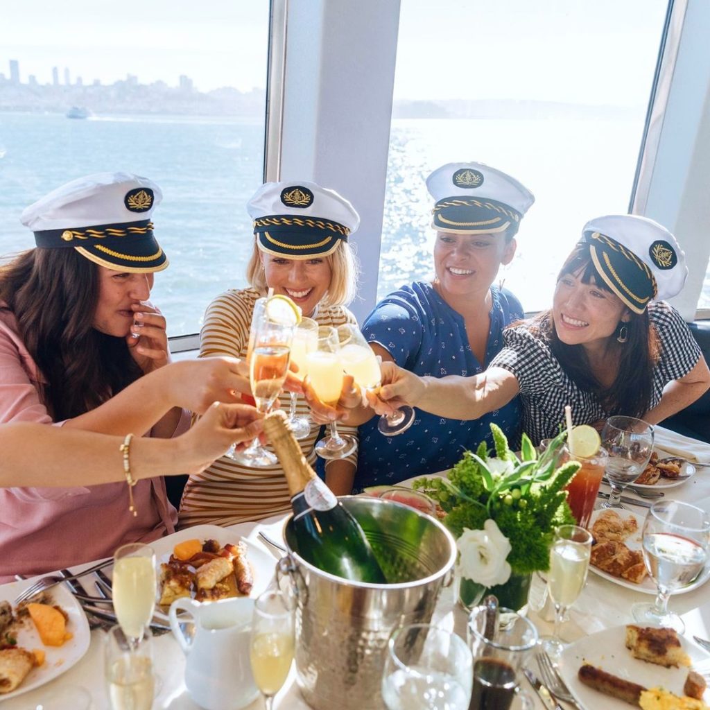 friends cheersing on a dinner cruise on the san diego bay