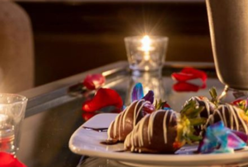 Chocolate Strawberry Dessert with Roses around the table