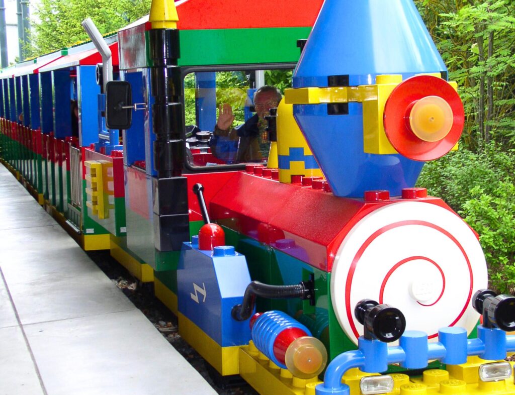 Legoland train with an elderly man waving