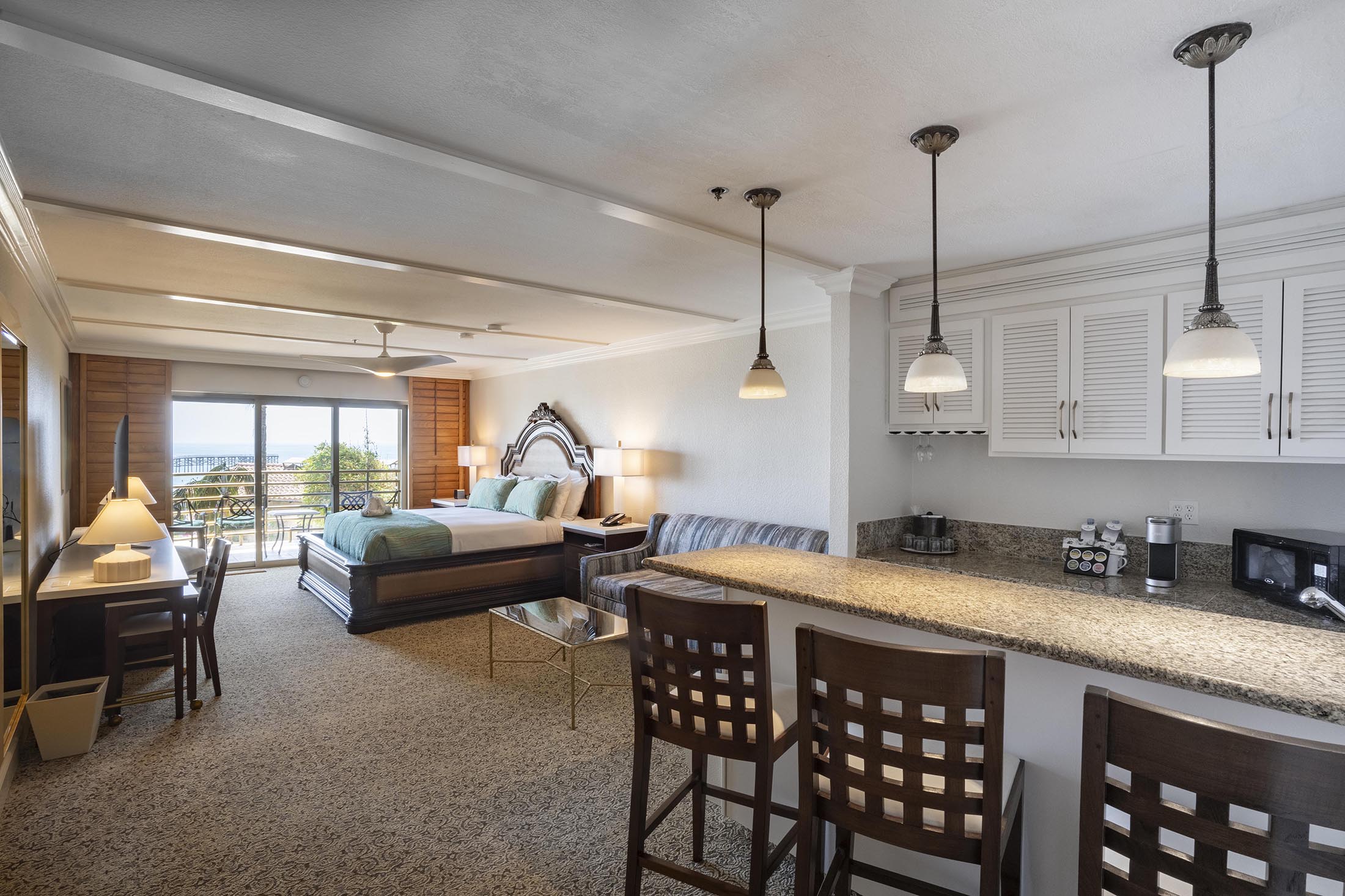 Dining, kitchen, sofa, tv, desk, and balcony