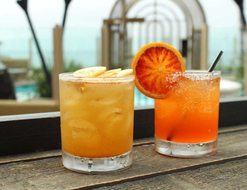 Two cocktails drinks with the pool view