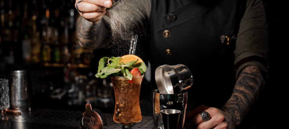 a bartender making cocktails