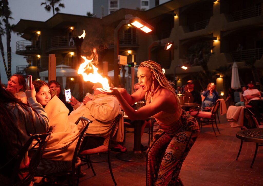 A performer with fire in her hand