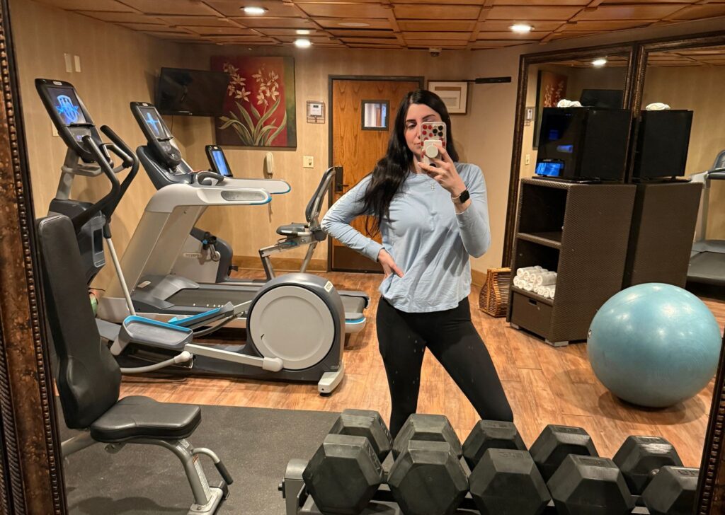 a woman taking a selfie at the gym