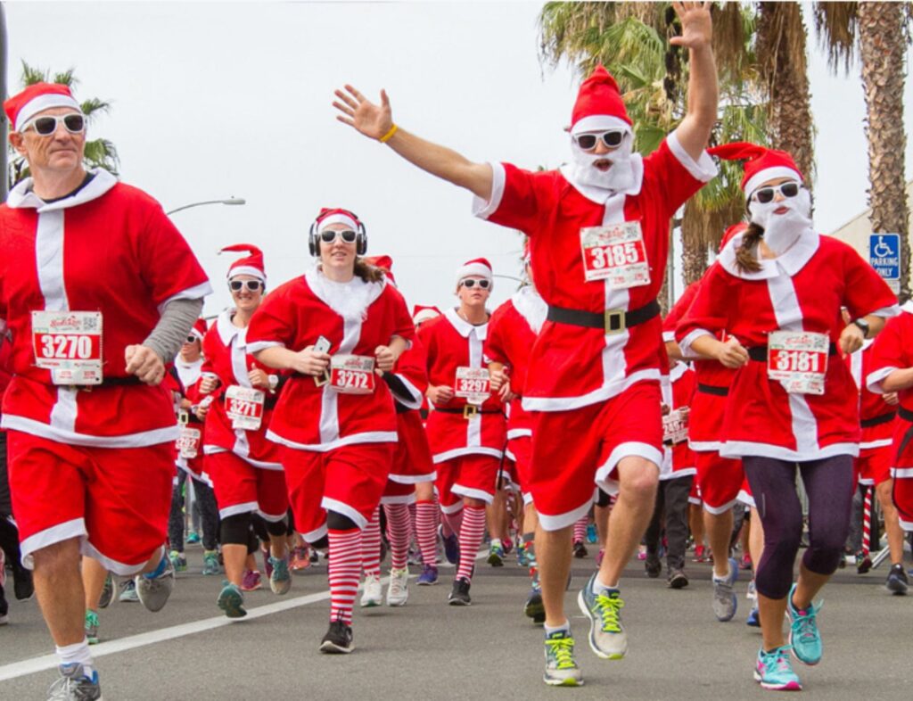 People running in santa outfits