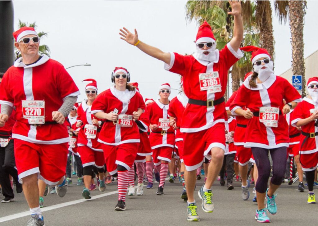 people running in santa outfits
