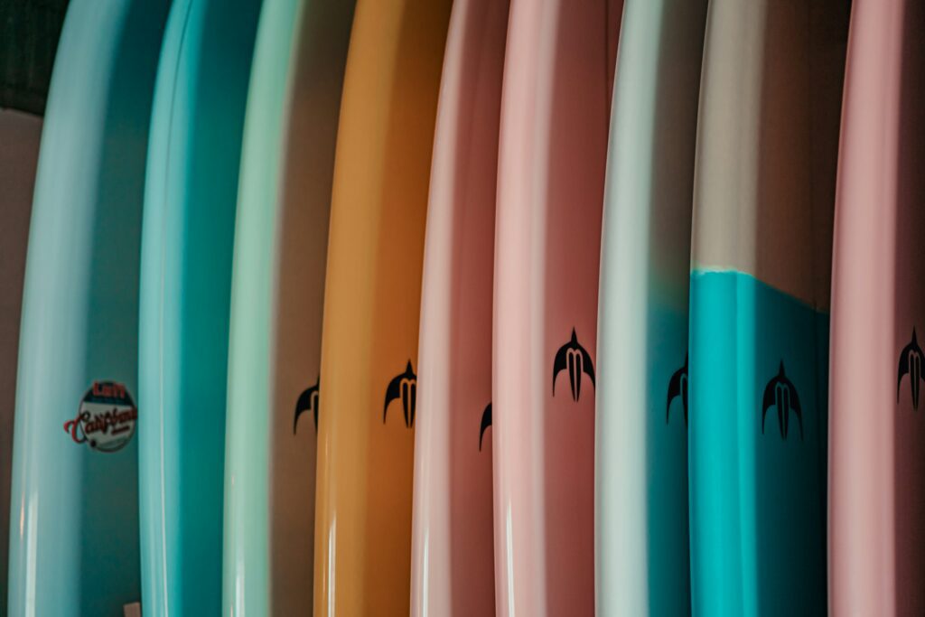 a colorful row of surfboards
