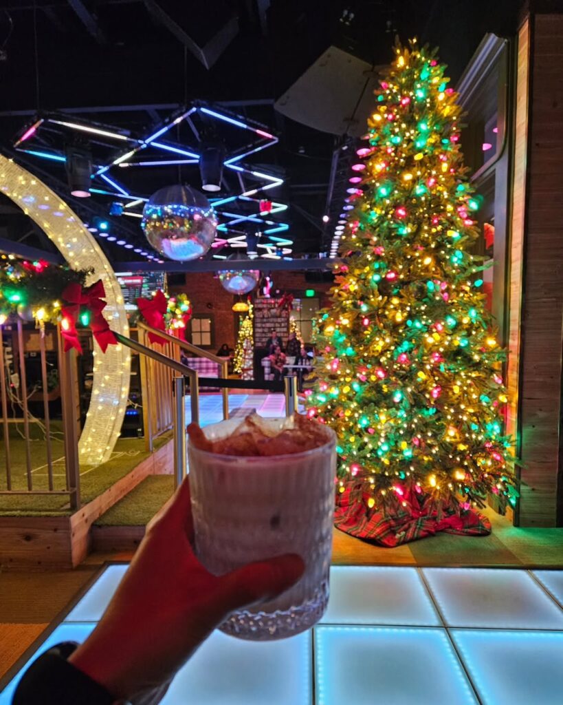 drink in fornt of christmas tree