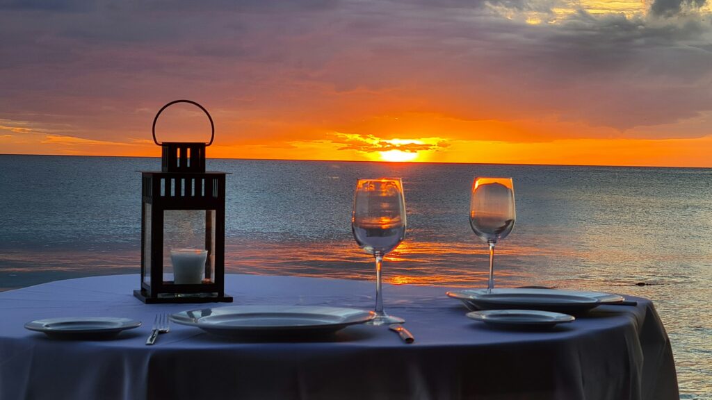 a table with wine by the ocean