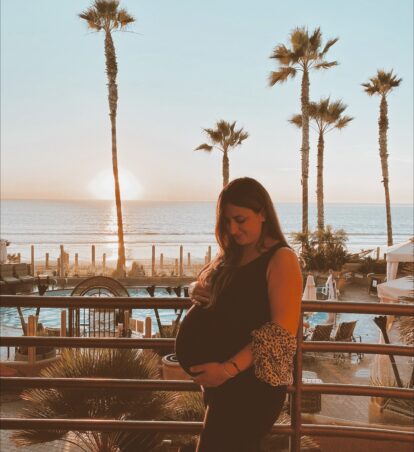 pregnant woman on balcony at pacific terrace