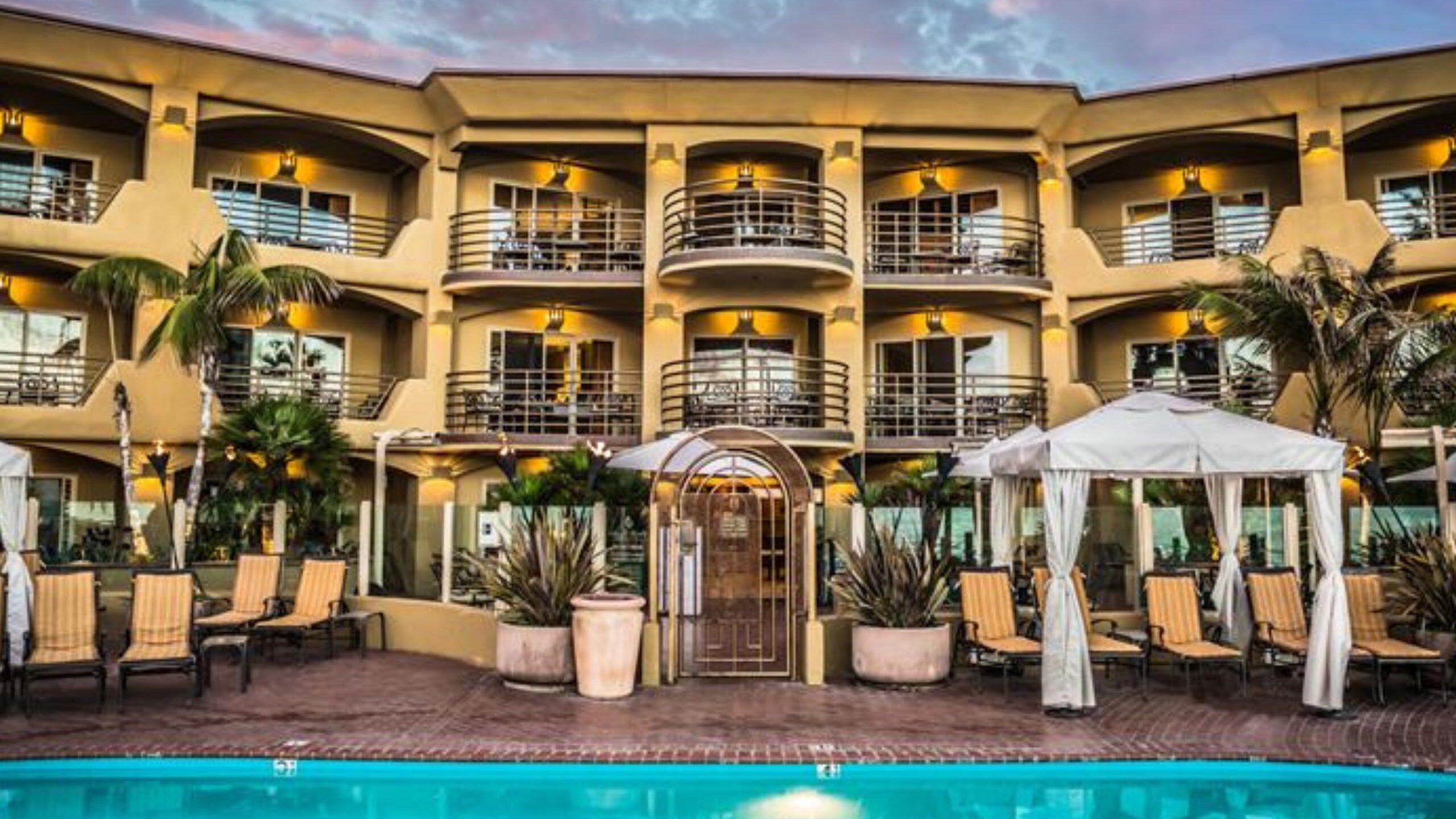 Front view of the hotel with pool