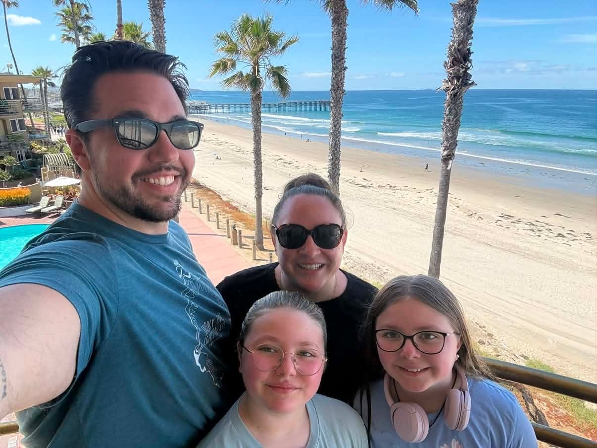 Family standing on balcony